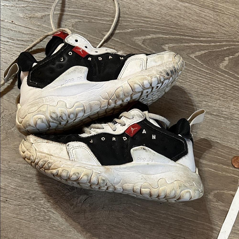 Jordan Black and White Athletic Shoes with Red Detail